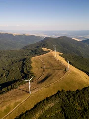 Aerial View of Wind Turbines Windmill Farm on Mountain Ridge at Sunset © sandsun