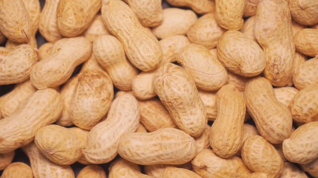 Close-Up of Unshelled Peanuts Background