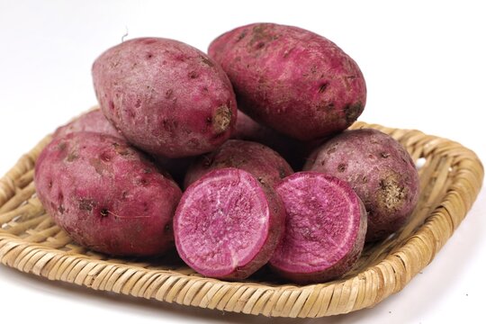  purple sweet potato or ubi ungu with naturally vibrant purple flesh and a mildly sweet flavor.