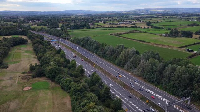 Aerial Video of M60 Motorway along Heaton Park Golf Course in Manchester