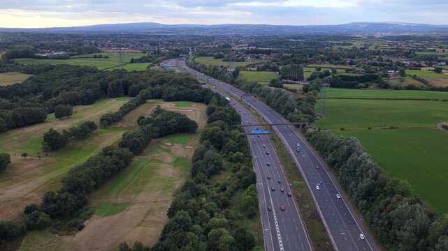 Aerial Video of M60 Motorway along Heaton Park Golf Course in Manchester