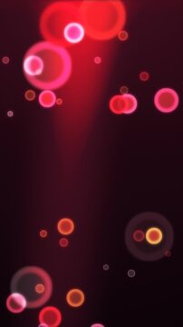 Abstract colorful bokeh circles on dark background. 2d animation