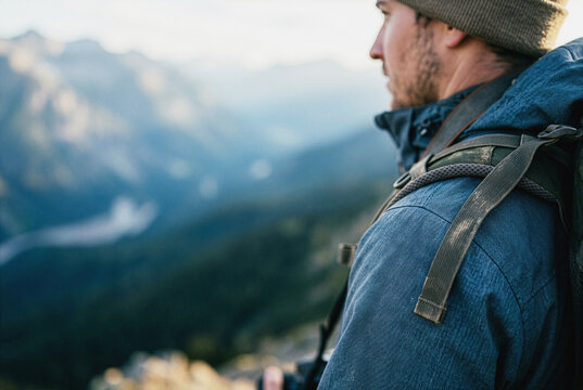 Hiker with backpack looking at mountain view