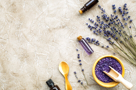 Essential oil and lavender salt with flowers top view