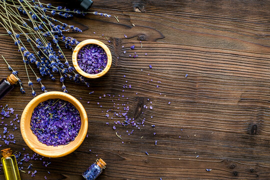 organic cosmetics with lavender on wooden background top view