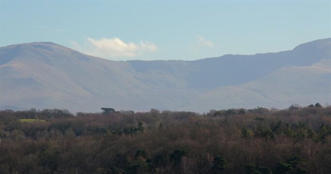 Shot of Mountains from A5, Ffordd Caergybi, Llanfairpwllgwyngyll at the Menai suspension bridge and Menai Strait