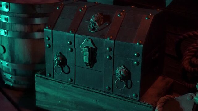 Pirate chest sits on deck. Slow zoom-in.
