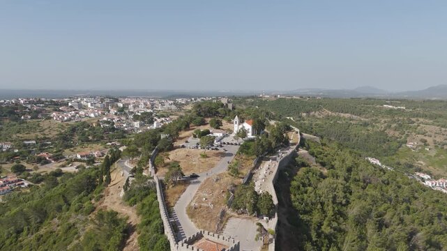 Aerial - Sesimbra Castle Ramparts And White Hilltop Church Above The Town In Portugal