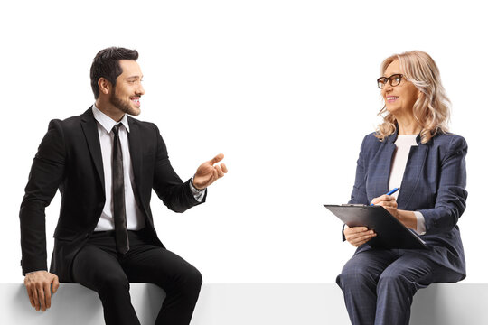 Business people sitting on a panel and discussing