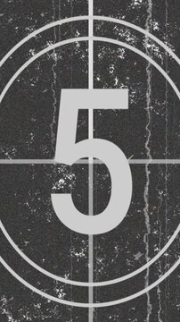 Vertical video, vintage countdown from 10 to 1, old film grunge texture, scratches, and dust effects
