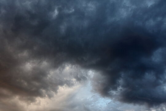 Dark sky with rain clouds, autumn rainy weather, storm clouds in the sky, dark dramatic clouds with rain clouds, storm
