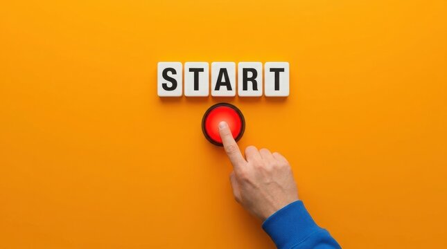 Hand pressing a red button with start text