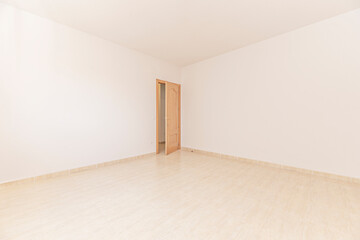 Fototapeta premium Empty room with beige tiled floor and open wooden door leading to adjacent space