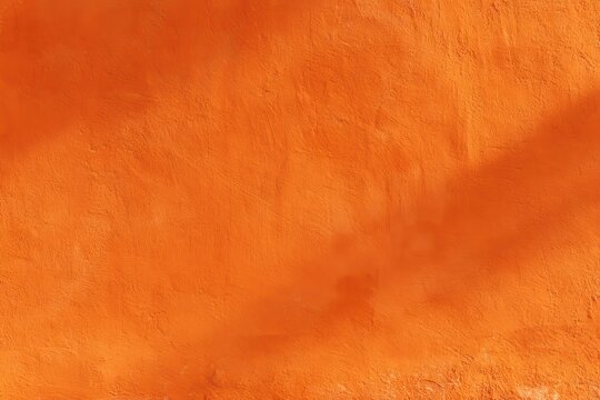 Bright orange wall texture with weathered plaster, ideal for creative backdrops