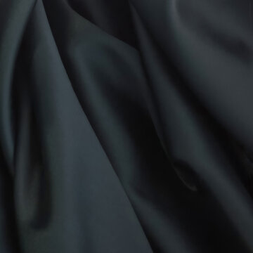 Square dark gray and black silk satin fabric background with smooth folds