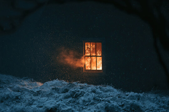 Dark building exterior with glowing orange window and falling snow