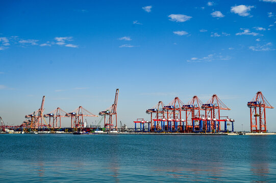 Red and blue container cranes and loading cranes at the Port of Mersin on the Mediterranean; a major industrial and commercial port in Mersin, Mersin Province, southern Turkey 13.09.2025