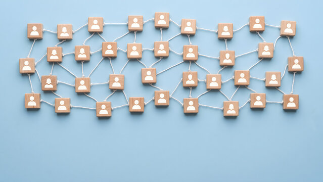 Interconnected Wooden Blocks with User Icons Symbolizing a Vast Social and Professional Network Grid Concept