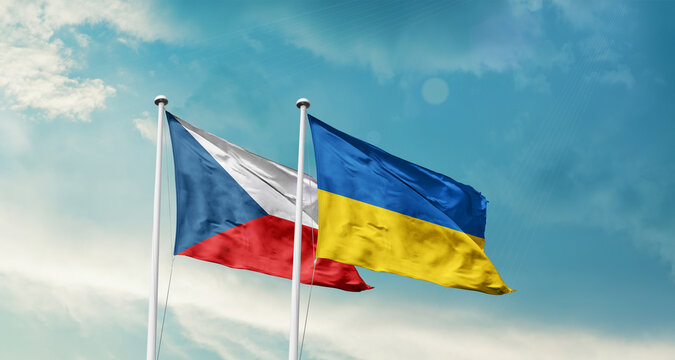 Czech Republic and Ukraine friendship flags are waving in the sky. Two country flag for agreement or deal. Czech Ukraine national flag for commitment.