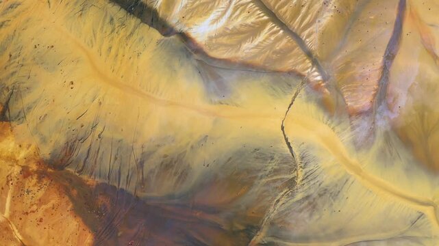  Flying over contaminated mine waters in decanting pond aerial view. Environmental pollution
