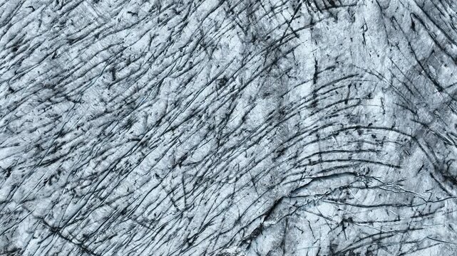 Aerial view of a large glacier surface with countless crevasses in the south of Iceland