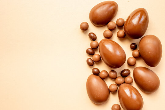 Chocolate background - various chocolate eggs and candies, top view