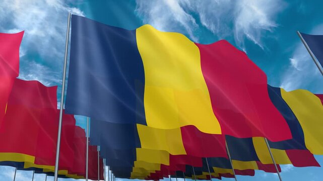 Multiple Chad flags seamless looping waving on blue sky