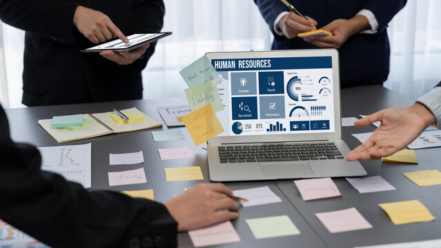 Human resources management software on computer screen helping human resources employee to manage recruitment, payroll, staff searching and KPI evaluation brisk