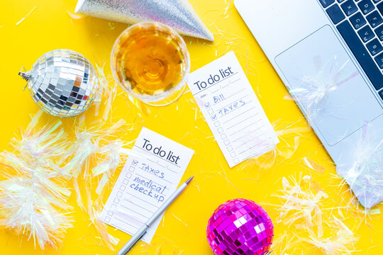 Work with fun. Laptop and to do lists with confetti and disco balls. Admin night party concept