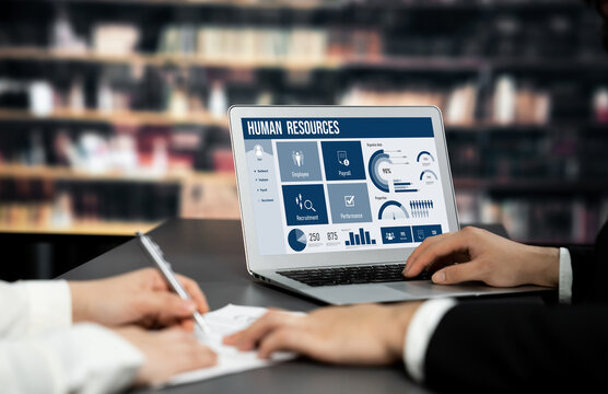 Human resources management software on computer screen helping human resources employee to manage recruitment, payroll, staff searching and KPI evaluation brisk