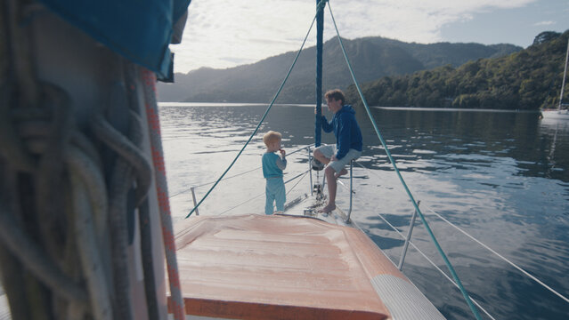 Family sailing on the small sailing boat in Brazil