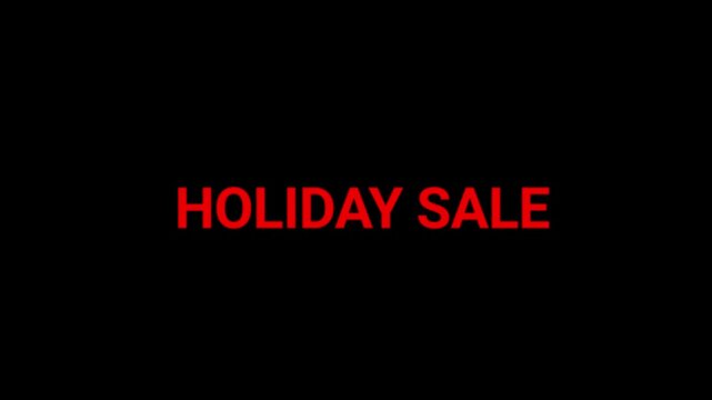 Holiday sale message shines in vibrant red characters on a deep black background to highlight seasonal retail shopping opportunities.
