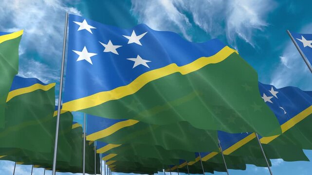 Multiple Solomon Islands flags seamless looping waving on blue sky