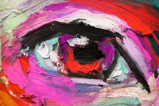 Close-up view of mixed oil pastels showing a girl's portrait