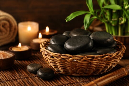 Hot stones with candles for spa treatment