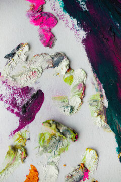 Close-up view of oil pastels showing vibrant colors and brush strokes