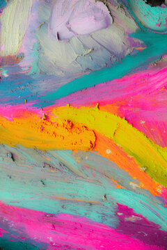 Vivid oil pastel strokes create abstract scenes and colorful textures