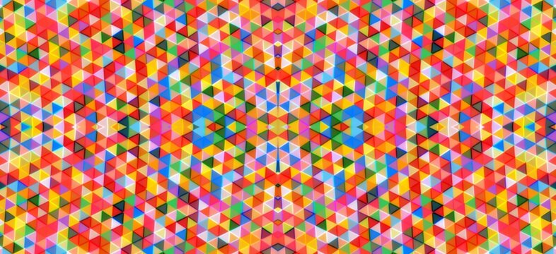Vibrant geometric pattern featuring repeating triangles in bright rainbow colors creating a complex abstract digital design