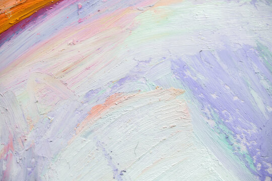 Mixing oil pastel fragments in an art activity featuring close-up details