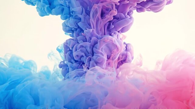 Blue and pink ink clouds rising and mixing in water