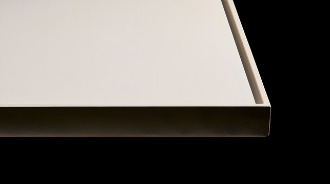 Minimalist white panel with clean edges and subtle shadowing against a dark background  emphasizing modern design and texture