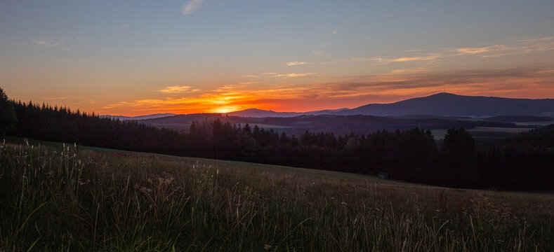 Panoramic sunset over landscape with Mount Klet near Cesky Krumlov Czech Republic