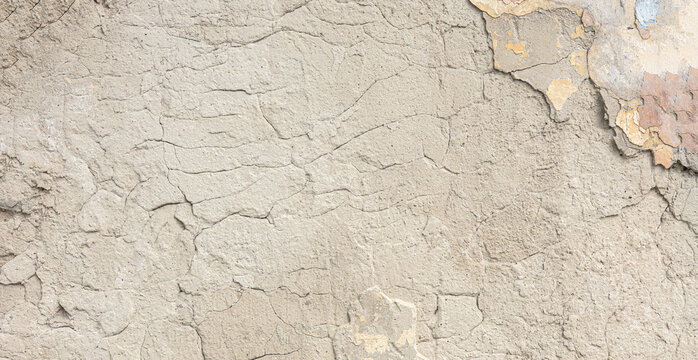 Cracked weathered wall texture showing peeling paint background