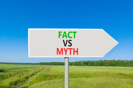 Fact vs versus myth words symbol. Concept words Fact vs Myth on beautiful grey road sign. Beautiful blue sky green grass background. Business and fact vs versus myth concept. Copy space.