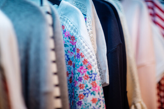 Row of Women's Clothing in Closet, Close-Up with Shallow Depth of Field