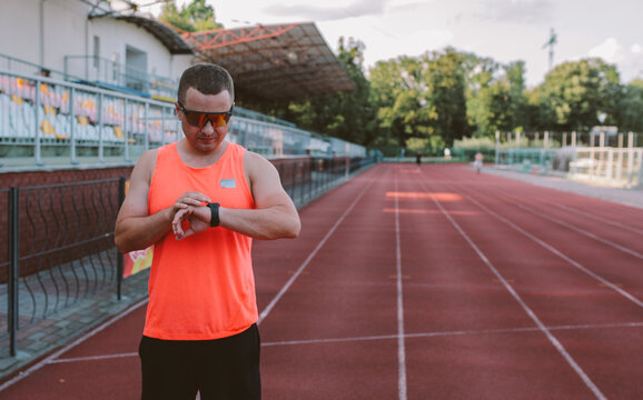 Male athlete training alone at outdoor sports stadium
