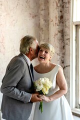 Joyful senior couple wedding embrace