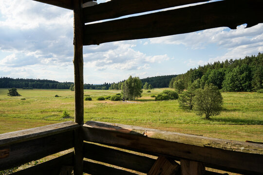 Bohemian landscape with meadows and forests, panoramic view from wooden hide, Czechia