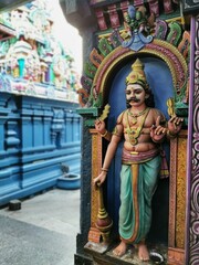 Obraz premium Colorful stone statue of a temple guardian deity at a South Indian Hindu temple, Pondicherry