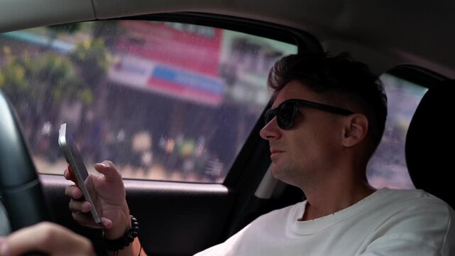 man driving car